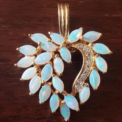 Lot 295: 14k Yellow Gold and Opal Heart Pendant 