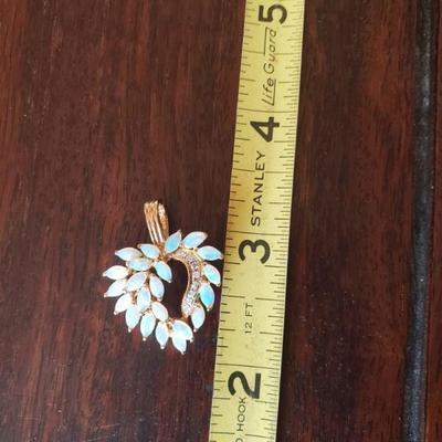 Lot 295: 14k Yellow Gold and Opal Heart Pendant 
