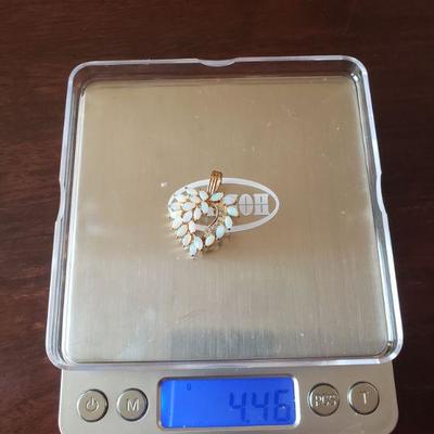 Lot 295: 14k Yellow Gold and Opal Heart Pendant 