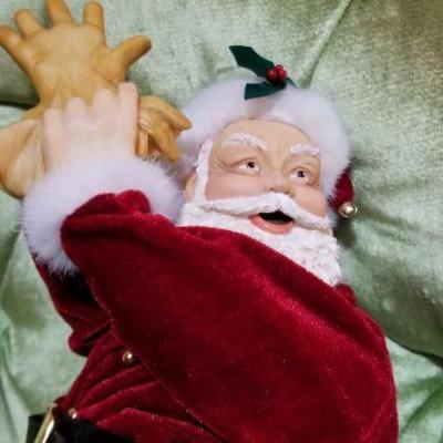 Lot #410; Vintage Santa Claus putting on gloves Christmas Figure