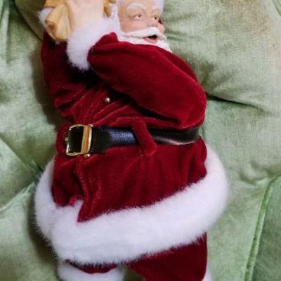 Lot #410; Vintage Santa Claus putting on gloves Christmas Figure