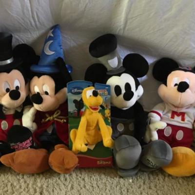 Lot #174 Four Milestone Mickey Plush Figures and Bean Bag Pluto
