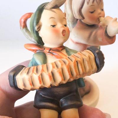 L25: Pair of Hummers Accordion Player and Angel 