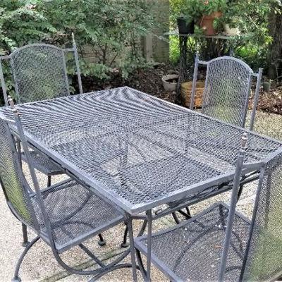 Lot #160  Cast Iron Patio Set - Table and Four Chairs