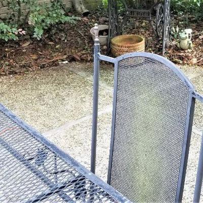 Lot #160  Cast Iron Patio Set - Table and Four Chairs