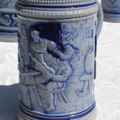 Lot 2-343: Large 1/2 Liter GERMANY Drinking Stein Set w/ 5 Glasses and 1 Tall Pitcher (lid is damaged)