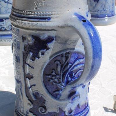 Lot 2-343: Large 1/2 Liter GERMANY Drinking Stein Set w/ 5 Glasses and 1 Tall Pitcher (lid is damaged)