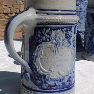 Lot 2-343: Large 1/2 Liter GERMANY Drinking Stein Set w/ 5 Glasses and 1 Tall Pitcher (lid is damaged)