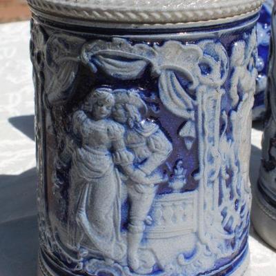Lot 2-343: Large 1/2 Liter GERMANY Drinking Stein Set w/ 5 Glasses and 1 Tall Pitcher (lid is damaged)