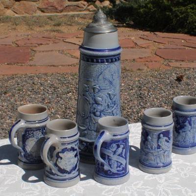 Lot 2-343: Large 1/2 Liter GERMANY Drinking Stein Set w/ 5 Glasses and 1 Tall Pitcher (lid is damaged)