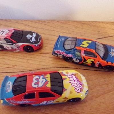 LOT 58  NASCAR TOY CARS AND T-SHIRT MADE INTO A CAR (UNOPENED)