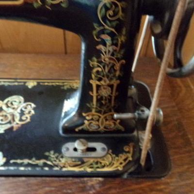 H-10  ANTIQUE TREADLE SEWING MACHINE IN CABINET