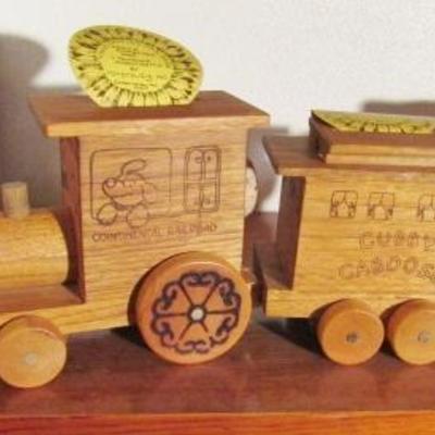 B-9  FOUR PIECE WOODEN COIN BANKS