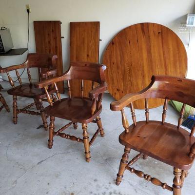 4 wood chairs with round table top. 2 extentions.