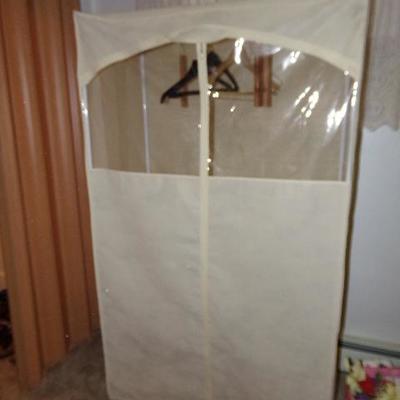 H-56  LADIES CLOTHES AND PORTABLE CLOSET