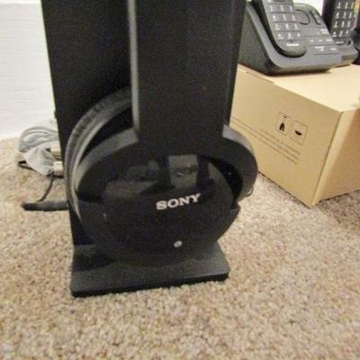 H-64  HEADPHONES, CORDLESS PHONES, MUSICAL COIN BANK AND MORE