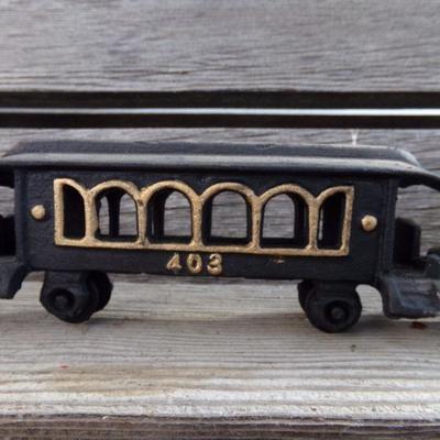 LOT 131  CAST IRON 4 PIECE TRAIN