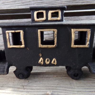 LOT 131  CAST IRON 4 PIECE TRAIN