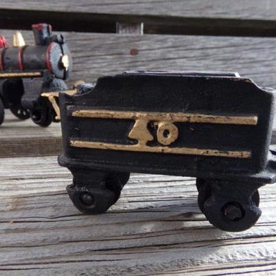 LOT 131  CAST IRON 4 PIECE TRAIN