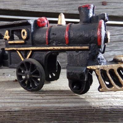 LOT 131  CAST IRON 4 PIECE TRAIN