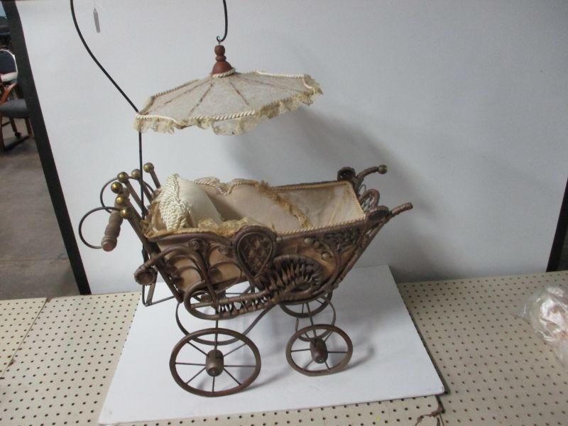 antique wicker baby carriage with parasol