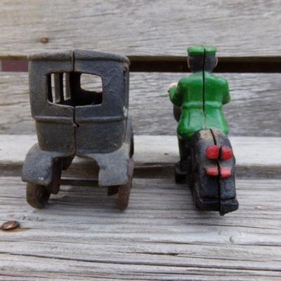 LOT 201  CAST IRON MOTORCYCLIST & SUV