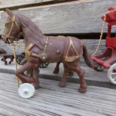 LOT 203  CAST IRON HORSE DRAWN TOYS