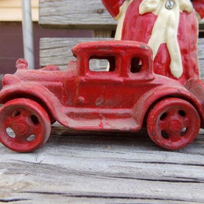 LOT 204  CAST IRON AUNT JEMIMA BANK & TOY CARS