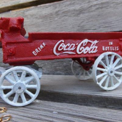 LOT 208  CAST IRON COCA COLA HORSE DRAWN TOY