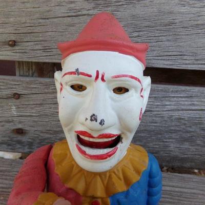 LOT 215  CAST IRON CLOWN COIN BANK