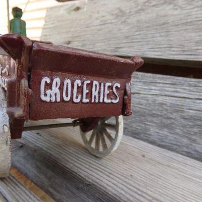 LOT 219  CAST IRON FRUIT CART AND CAR TOYS