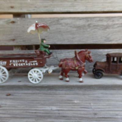 LOT 219  CAST IRON FRUIT CART AND CAR TOYS