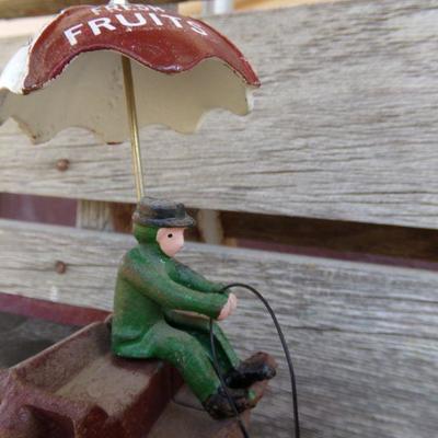 LOT 219  CAST IRON FRUIT CART AND CAR TOYS