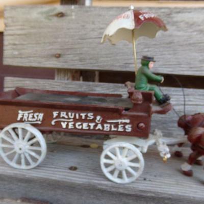 LOT 219  CAST IRON FRUIT CART AND CAR TOYS