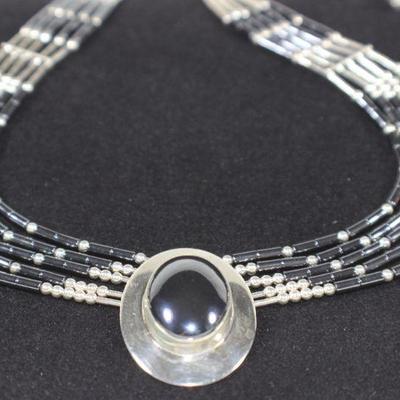 LOT#A32: Marked Sterling Liquid Silver Necklace with Hematite Stones