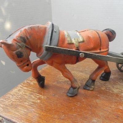 LOT 306  CAST IRON HORSE DRAWN WAGON