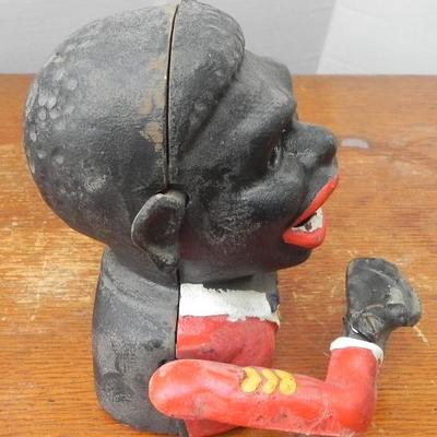 LOT 313  POLITICALLY INCORRECT CAST IRON COIN BANK