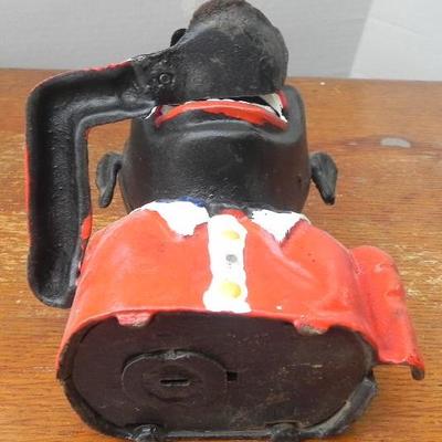 LOT 313  POLITICALLY INCORRECT CAST IRON COIN BANK