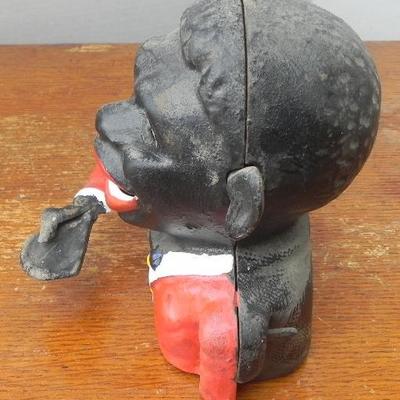 LOT 313  POLITICALLY INCORRECT CAST IRON COIN BANK