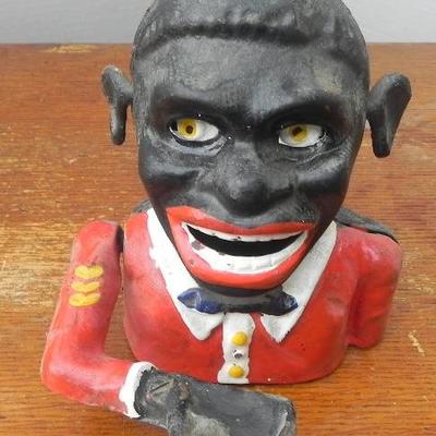 LOT 313  POLITICALLY INCORRECT CAST IRON COIN BANK