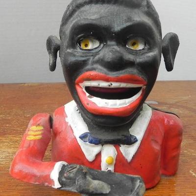 LOT 313  POLITICALLY INCORRECT CAST IRON COIN BANK