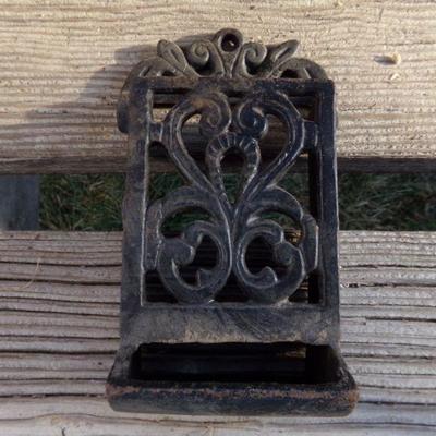 LOT 269   IRON BRACES AND CAST MATCH HOLDER