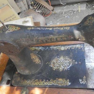 LOT 273  SINGER TREADLE SEWING MACHINE IN CABINET