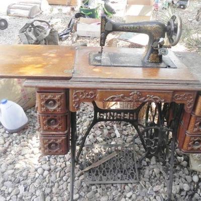 LOT 273  SINGER TREADLE SEWING MACHINE IN CABINET
