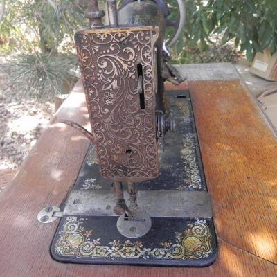 LOT 273  SINGER TREADLE SEWING MACHINE IN CABINET