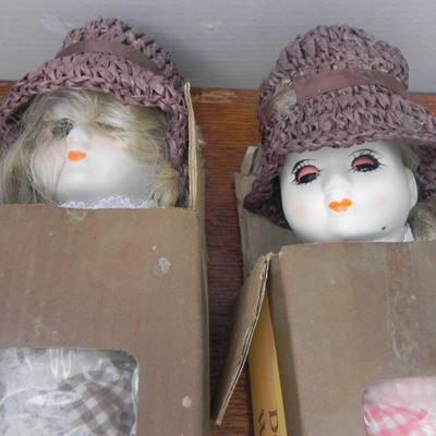 LOT 286  FOUR PORCELAIN DOLLS