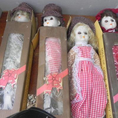 LOT 286  FOUR PORCELAIN DOLLS