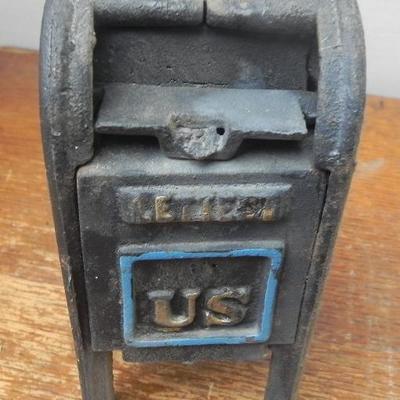 LOT 284  TWO CAST IRON COIN BANKS
