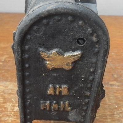 LOT 284  TWO CAST IRON COIN BANKS