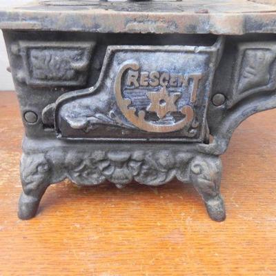 LOT 281  CRESCENT CAST IRON TOY STOVE